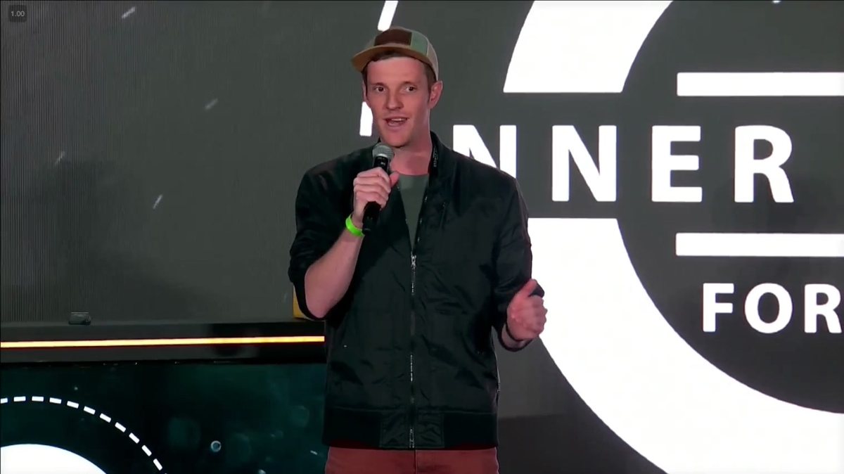 Christian speaking on stage in Boise