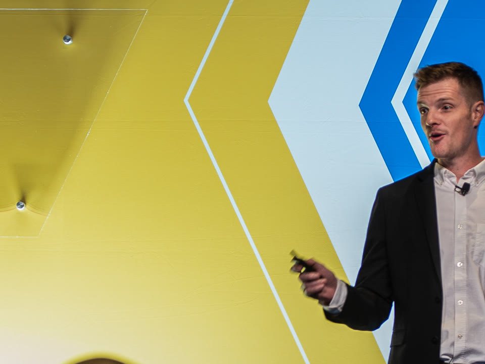 Christian giving a keynote on stage
